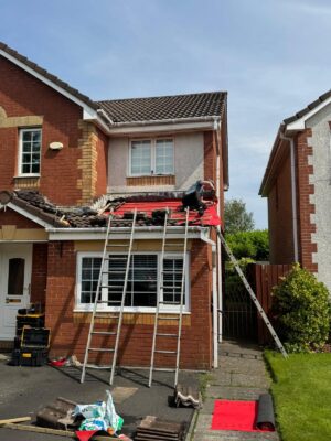 Repairing broken roof tiles after storm damage